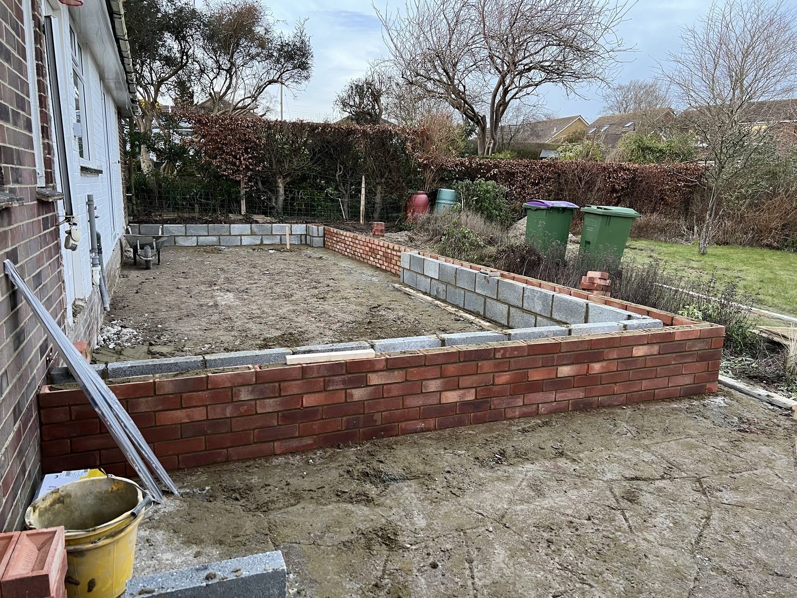 Extension brickwork and blockwork under way beside an existing house